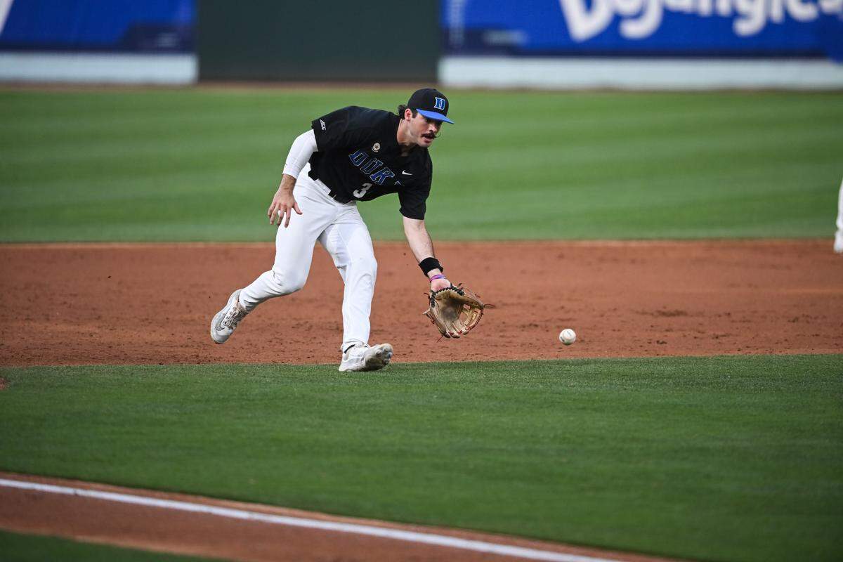 Duke third baseman Ben Miller fields a ground ball during an ACC baseball tournament semifinal game against Miami Saturday night at Truist Field in Charlotte.