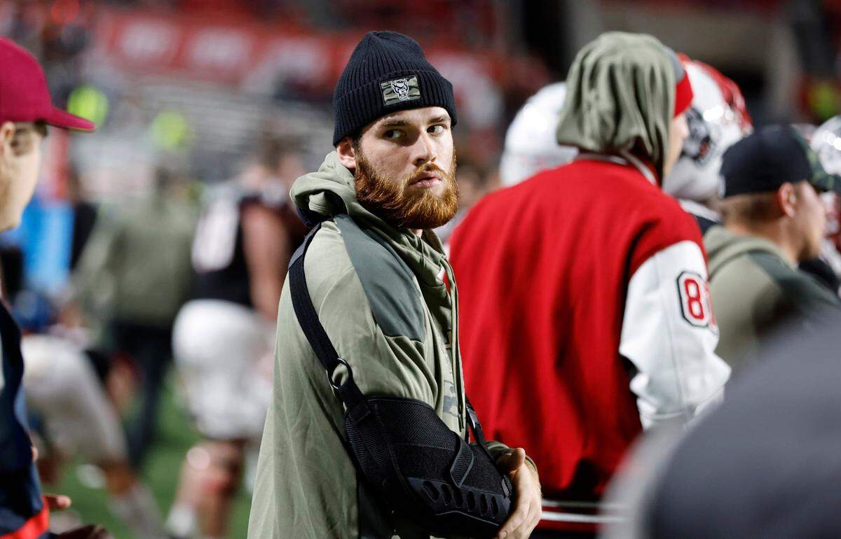 N.C. State quarterback Devin Leary stands on the sidelines during the second half of N.C. State’s 22-21 victory over Virginia Tech at Carter-Finley Stadium in Raleigh, N.C., Thursday, Oct. 27, 2022.