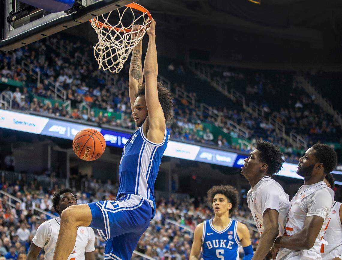 Duke’s Dereck Lively II (1) gets a dunk against Miami’s Anthony Walker (1) during the first half during in the semi-finals of the ACC Tournament on Friday, March 10, 2023 at the Greensboro Coliseum in Greensboro, N.C.