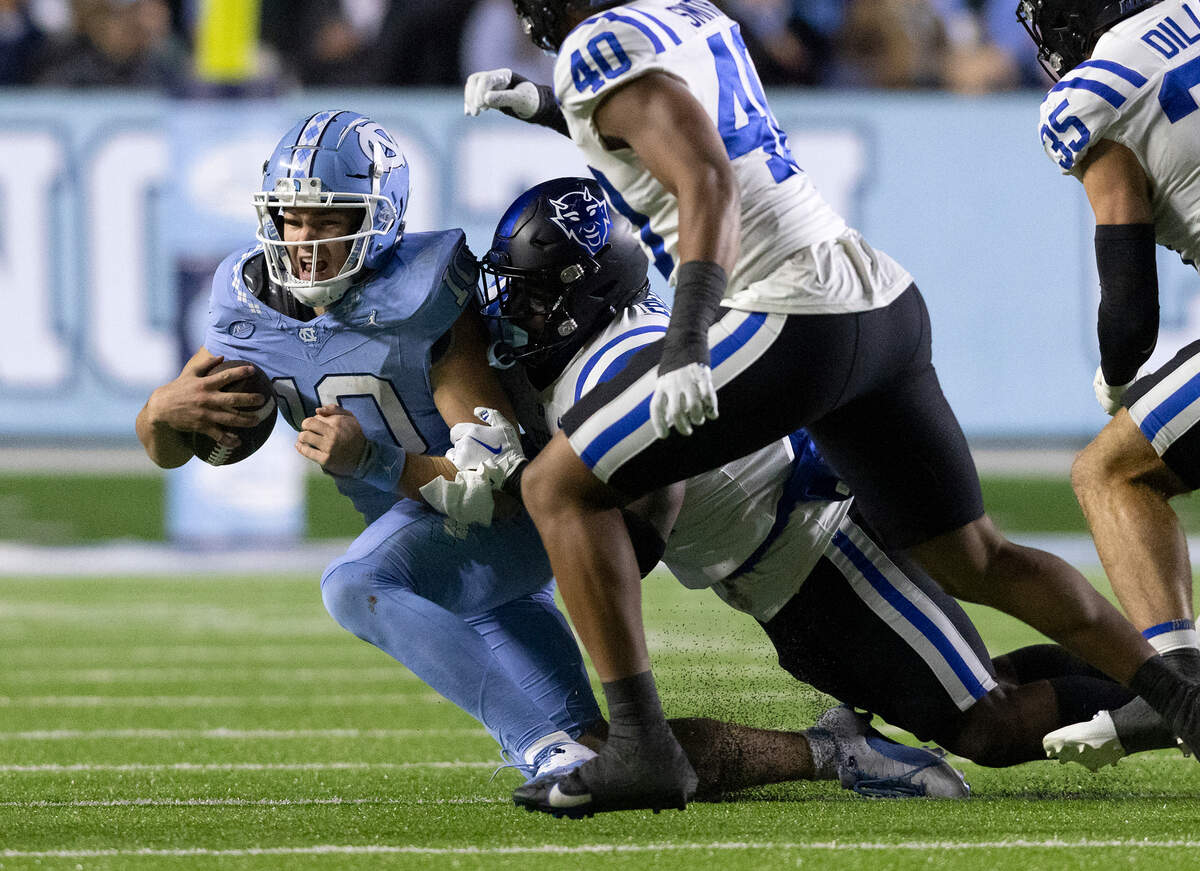 North Carolina’s Drake Maye is sacked by Duke’s Tre Freeman during the second half of the Blue Devils’ 47-45 loss on Saturday, Nov. 11, 2023, at Kenan Stadium in Chapel Hill, N.C.