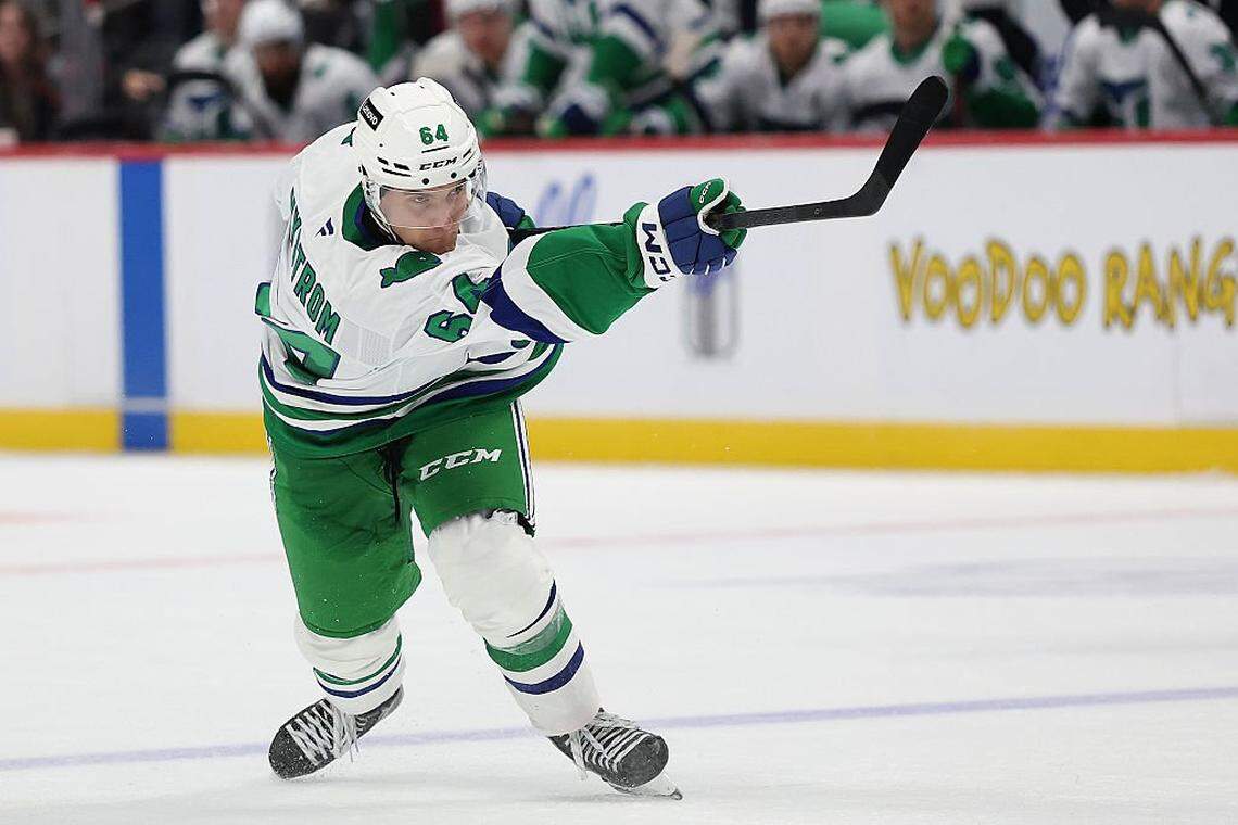 Joel Nystrom of the Carolina Hurricanes fires a shot in his NHL debut against the Colorado Avalanche in the third period at Ball Arena on October 23, 2025 in Denver, Colorado.