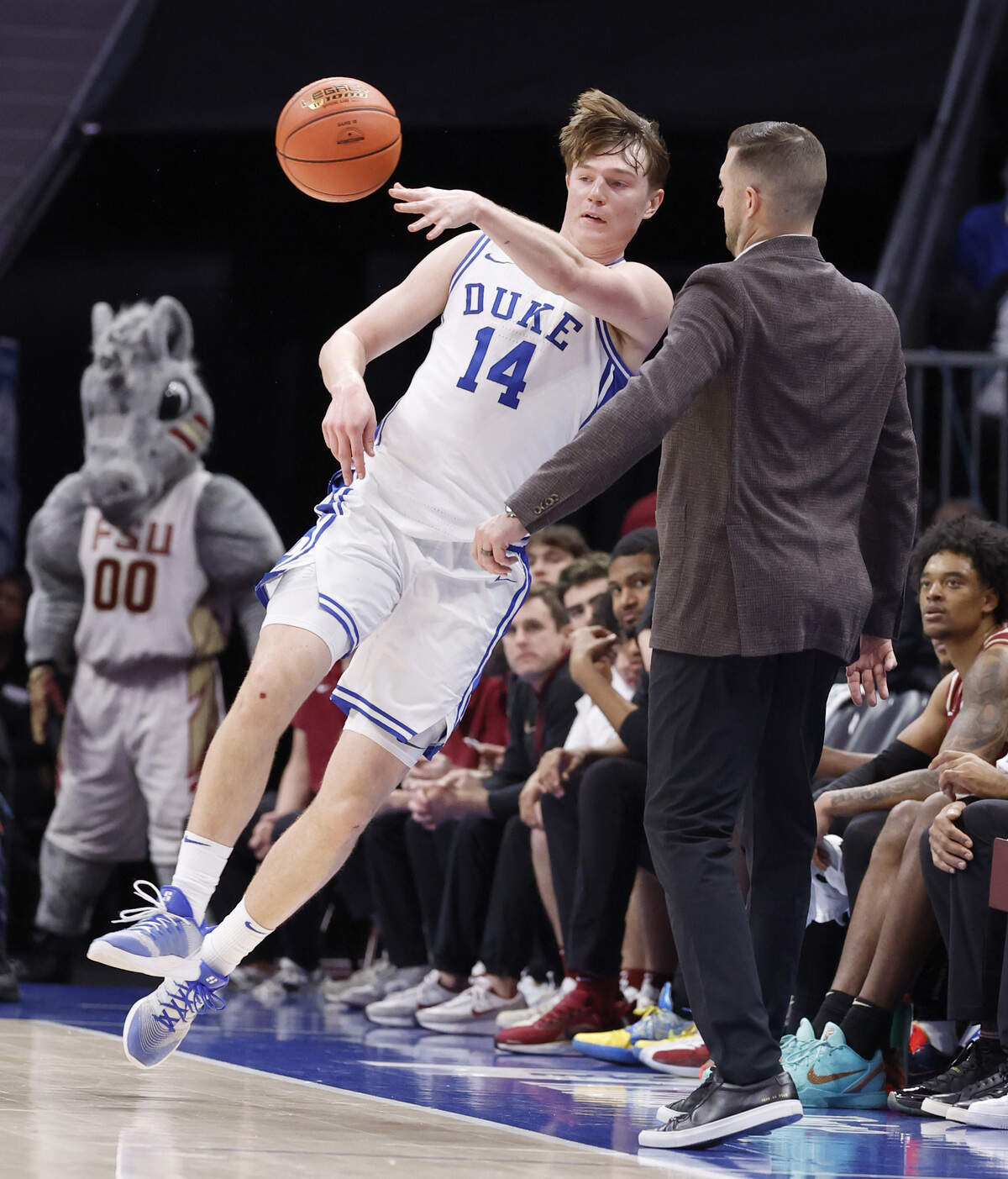 Duke’s Nikolas Khamenia (14) saves the ball from going out of bounds in the second half of Duke’s 80-79 victory over Florida State in the quarterfinals of the 2026 ACC MenÕs Basketball Tournament at the Spectrum Center in Charlotte, N.C., Thursday, March 12, 2026.