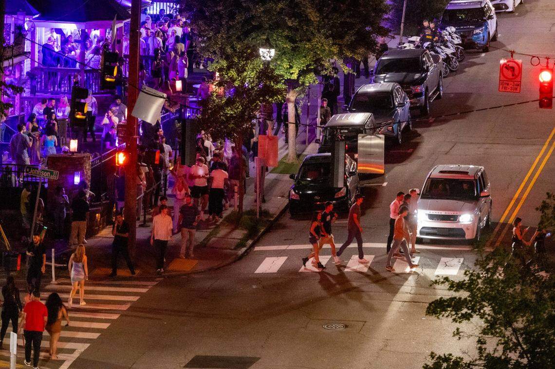Glenwood Avenue and Cornerstone Tavern bustle with club-goers before 1 a.m. in the Glenwood South district on Friday, July 21, 2023.