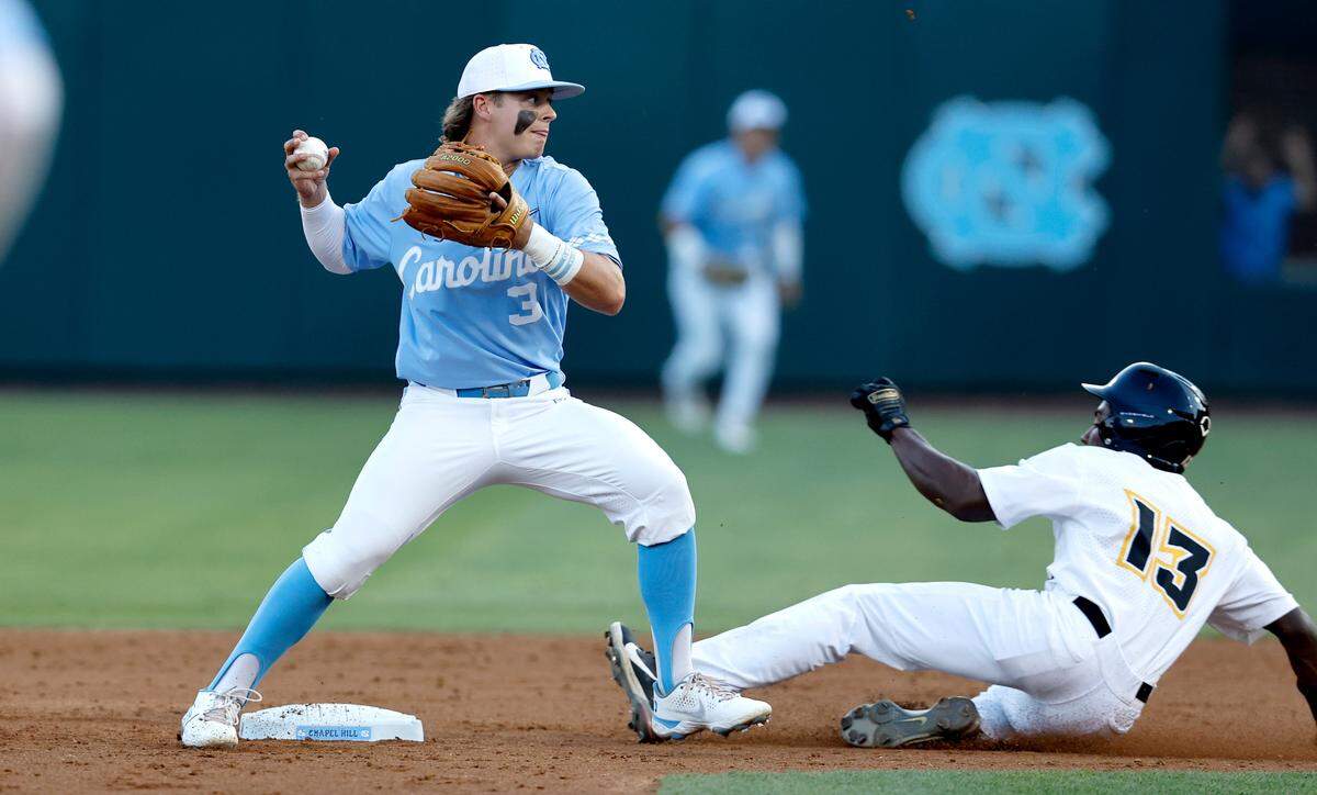 North Carolina’s Colby Wilkerson (3) gets ready to turn two after forcing out VCU’s AJ Mathis (13) in the second inning during UNC’s game against VCU in the NCAA Regional at at Boshamer Stadium in Chapel Hill, N.C. Saturday, June 4, 2022.