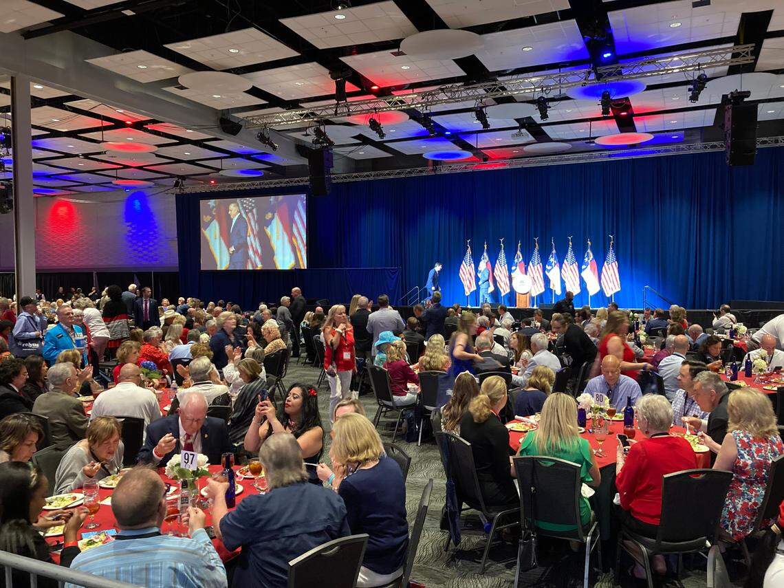 NC GOP Chairman Michael Whatley welcomes U.S. Rep. David Rouzer onto the stage to speak during the Republican Party’s annual state convention in Greenville on Saturday, June 5, 2021.