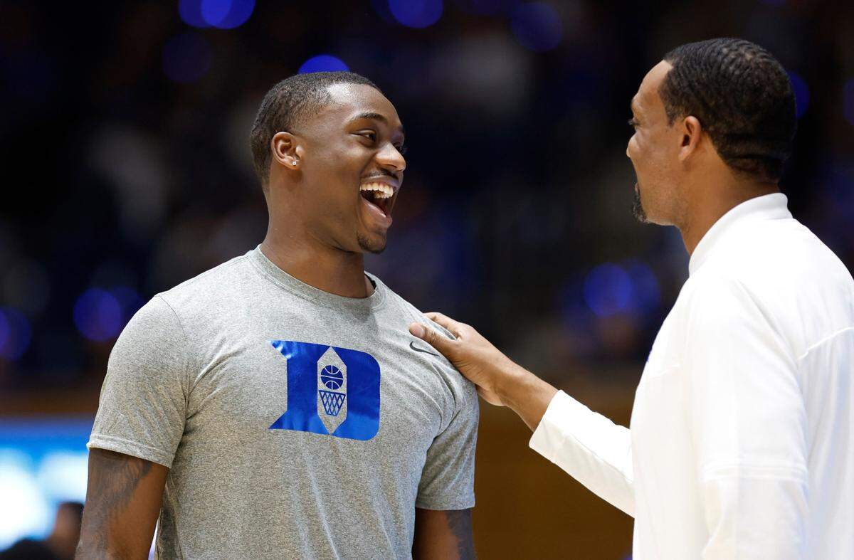Duke’s Dariq Whitehead talks with associate head coach Chris Carrawell before the Blue-White scrimmage during Duke’s Countdown to Craziness at Cameron Indoor Stadium in Durham, N.C., Friday, Oct. 21, 2022.