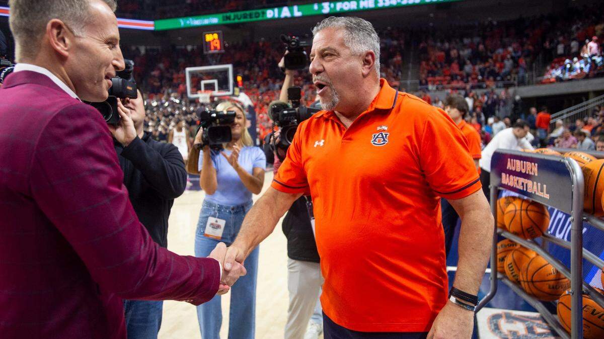 Alabama coach Nate Oats (left) and Auburn coach Bruce Pearl shake hands before a game at Neville Arena on Feb. 7, 2024.