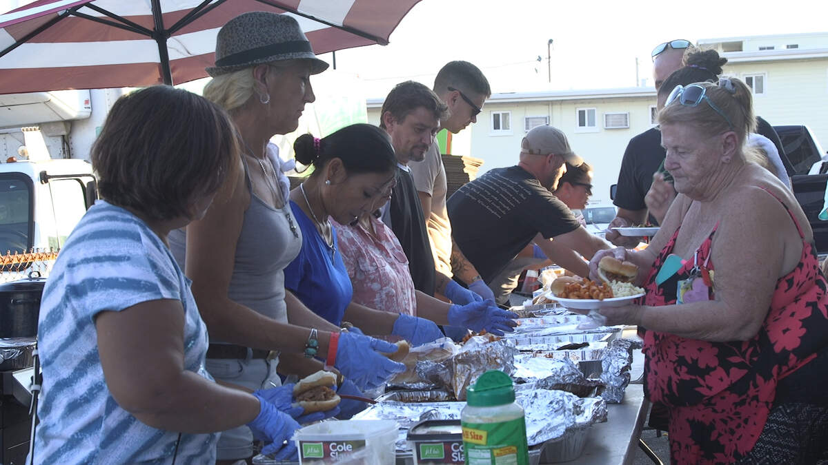Volunteers serve dinner to guests at The Midtown Inn & Cottages in Myrtle Beach on Saturday, Sept. 22, 2018.