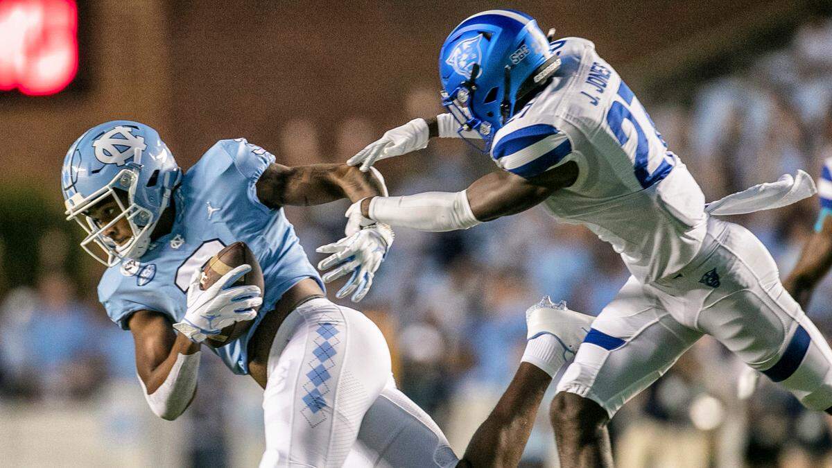 North Carolina’s Antoine Green (3) pulls in a 31-yard pass from quarterback Sam Howell ahead of Georgia State’s Jaylon Jones (27) in the first quarter on Saturday, September 11, 2021 at Kenan Stadium in. Chapel Hill, N.C.