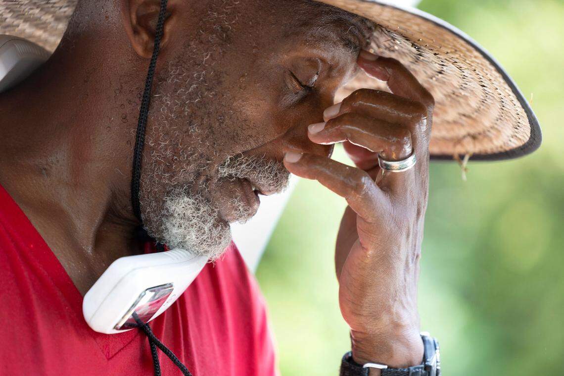 Kenneth Jeffreys takes a break while working on detailing a car at Peter’s Hand Car Wash on Capital Blvd in Raleigh, N.C., Thursday, July 27, 2023. “Man, it’s hot. It’s hot” said Jeffreys. “It’s so hot it makes me dizzy.”