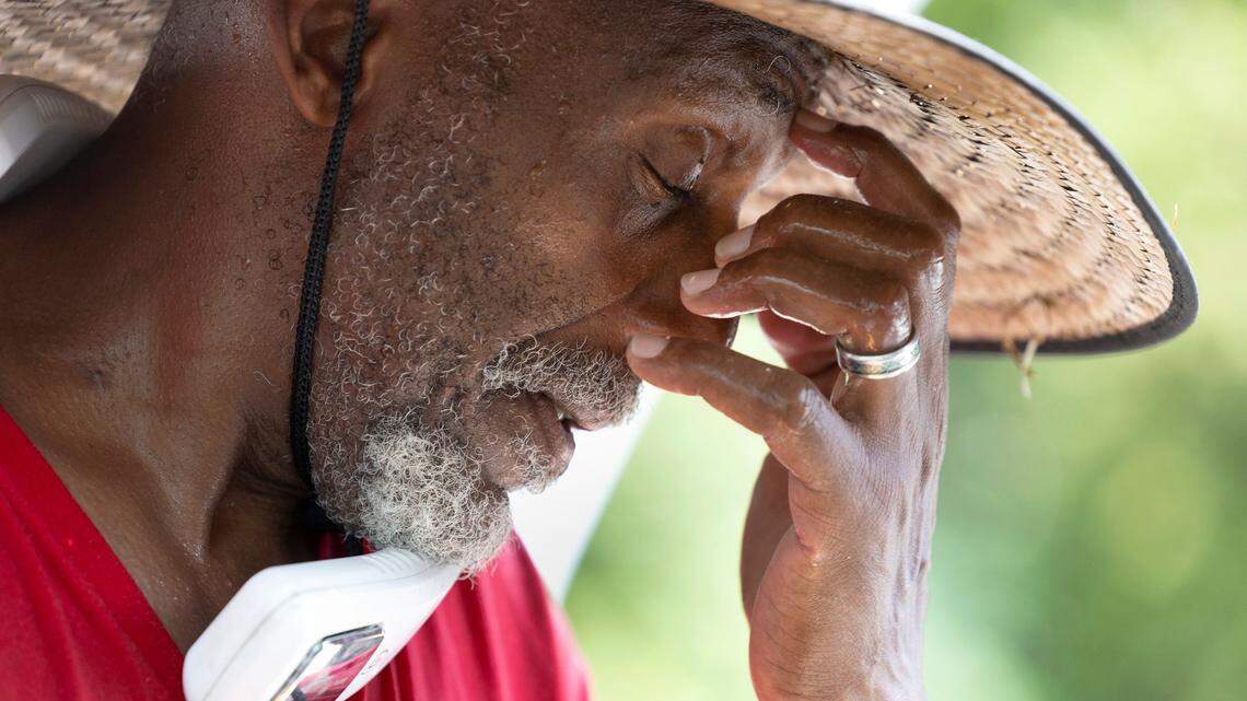 Kenneth Jeffreys takes a break while working on detailing a car at Peter’s Hand Car Wash on Capital Blvd in Raleigh, N.C., Thursday, July 27, 2023. “Man, it’s hot. It’s hot” said Jeffreys. “It’s so hot it makes me dizzy.”