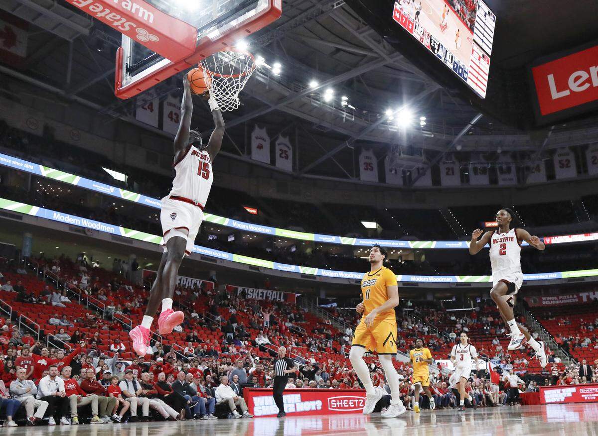 N.C. State’s Jerry Deng slams in two during the second half of the Wolfpack’s 110-64 win over UNC Greensboro on Wednesday, Nov. 12, 2025, at Lenovo Center in Raleigh, N.C.