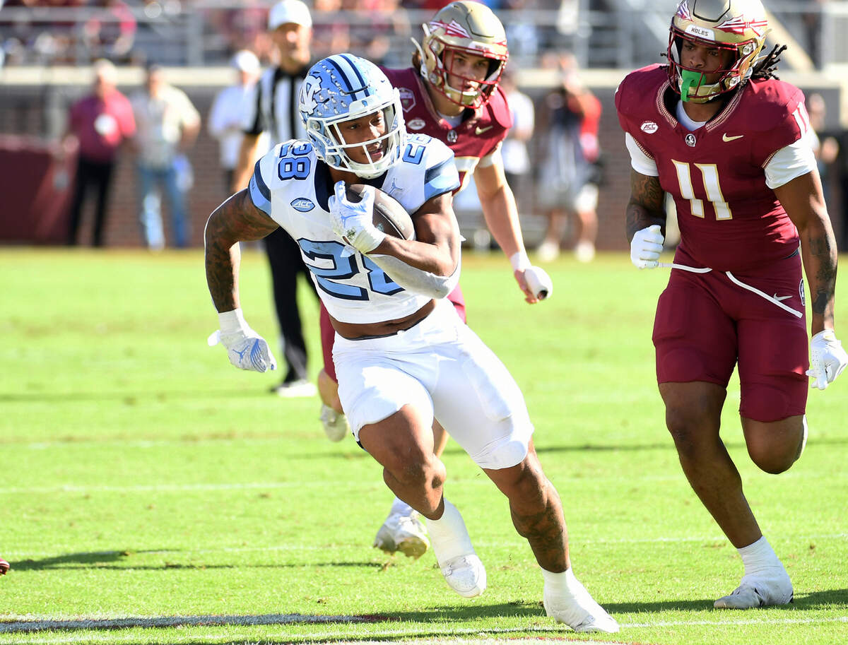 Nov 2, 2024; Tallahassee, Florida, USA; North Carolina Tarheels running back Omarian Hampton (28) runs the ball against the Florida State Seminoles during the first quarter at Doak S. Campbell Stadium. Mandatory Credit: Robert Myers-Imagn Images