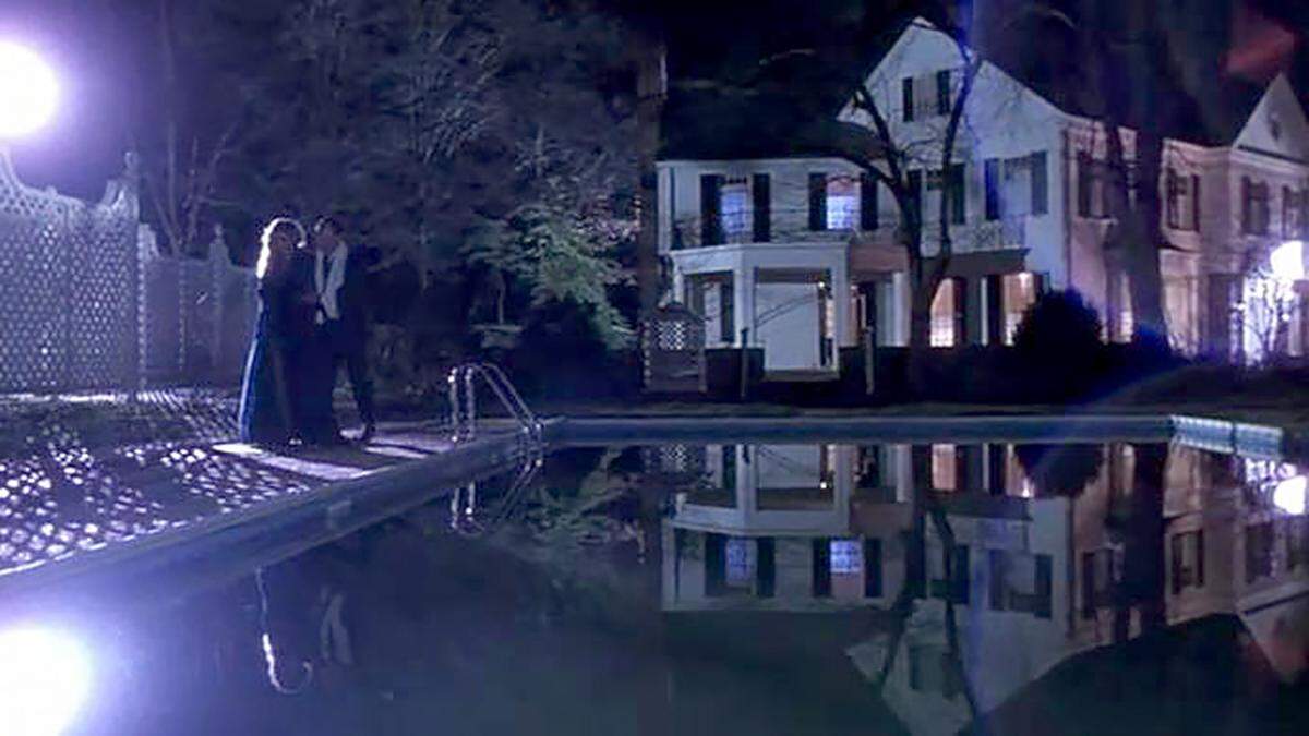 An exterior shot from the 1990 film “The Handmaid’s Tale” showing the house and pool at 1810 Cedar St. in Durham.