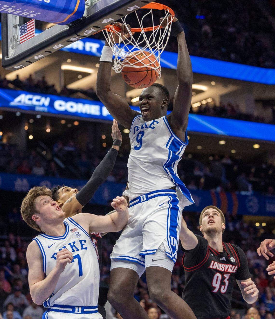 Duke’s center Khaman Maluach (9) breaks to the basket for a dunk over Louisville’s Noah Waterman (93) in the first half on Saturday, March 15, 2025 during the ACC Tournament Championship at Spectrum Center in Charlotte, N.C.