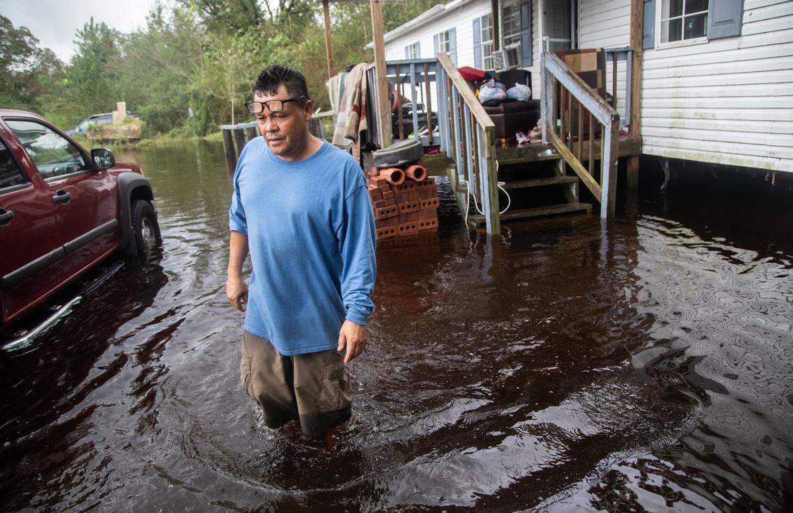 Luis  Lucio, 50, stands in the yard of his flooded home on Will Baker Road in Kinston Sunday, Sept. 16, 2018 following the aftermath of Hurricane Florence. Flood levels are expected to rise in parts of Kinston.
