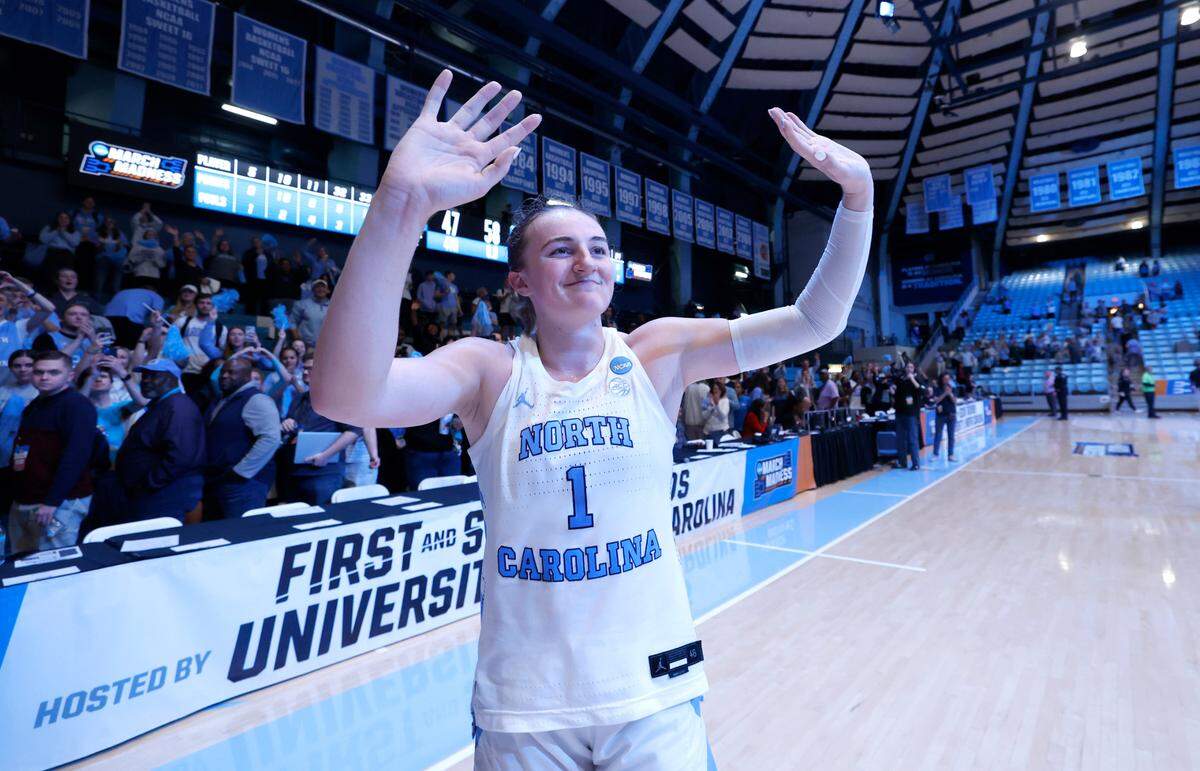 North Carolina’s Alyssa Ustby (1) waves to the fans as she leaves the court after UNC’s 58-47 victory over West Virginia in the second round of the NCAA women’s basketball tournament at Carmichael Arena in Chapel Hill, N.C., Monday, March 24, 2025.