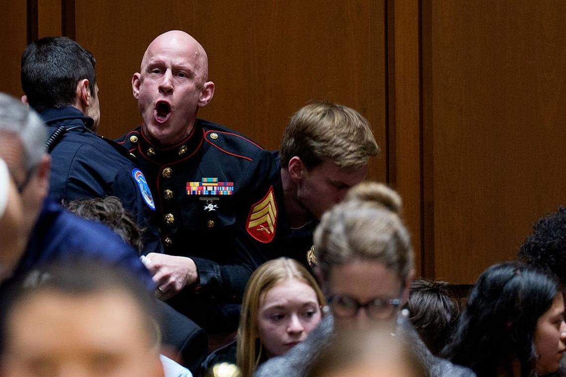 WASHINGTON, DC - MARCH 4: Brian McGinnis, a protester dressed in a military uniform, disrupts a Senate Armed Services Subcommittee hearing on Capitol Hill on March 4, 2026 in Washington, DC. The protester has been identified as Brian McGinnis from North Carolina. The Subcommittee on Readiness and Management Support is holding a hearing to examine the current readiness of the Joint Force. (Photo by Andrew Harnik/Getty Images)