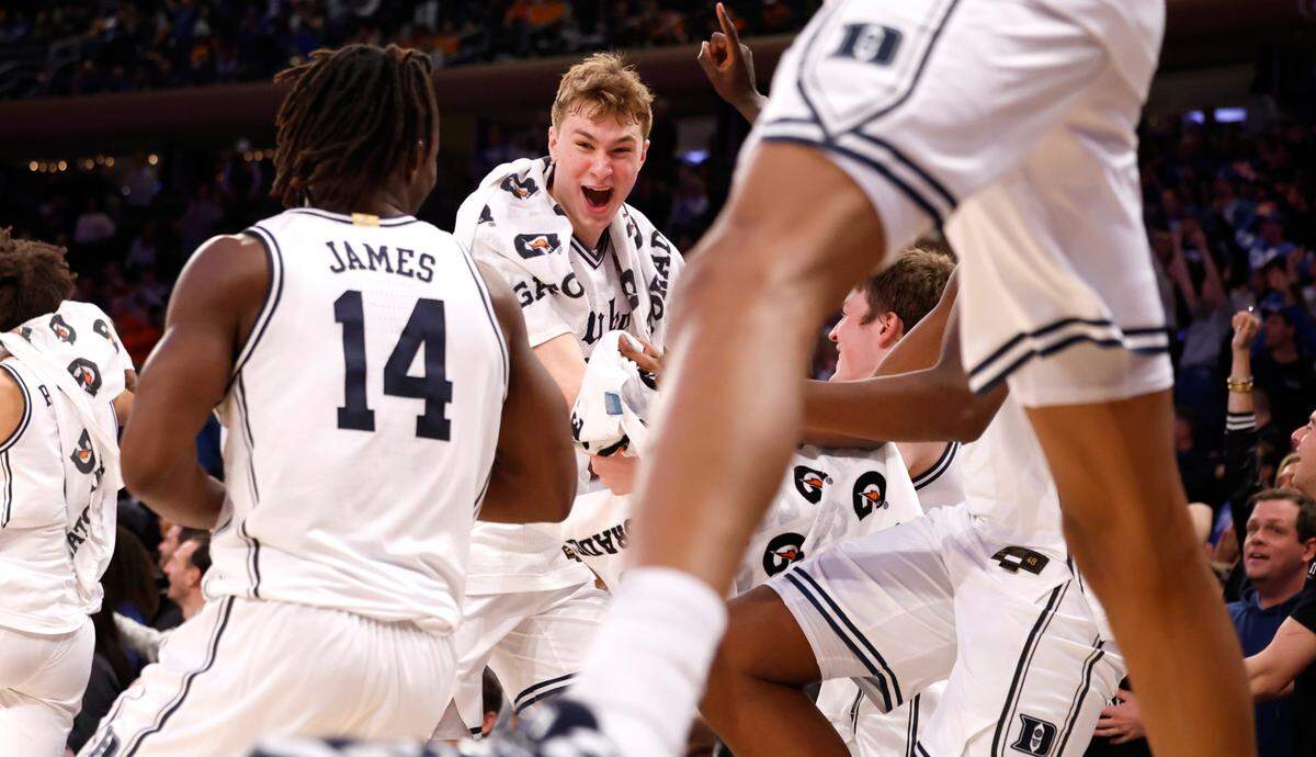 Duke’s Cooper Flagg (2) and the bench celebrate what they think is a block by Stanley Borden during the second half of Duke’s 110-67 victory over Illinois in the SentinelOne Classic at Madison Square Garden in New York City Saturday, Feb. 22, 2025.
