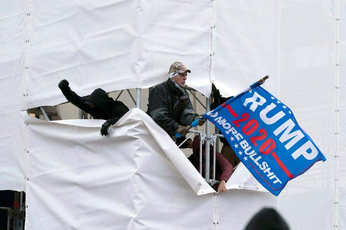 Trump supporters are seen outside the Capitol, Wednesday, Jan. 6, 2021, in Washington. As Congress prepares to affirm President-elect Joe Biden’s victory, thousands of people have gathered to show their support for President Donald Trump and his claims of election fraud.