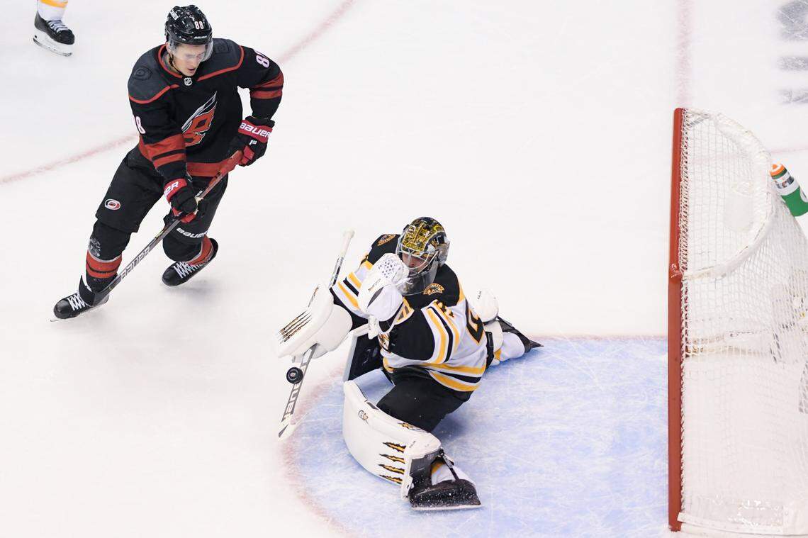 Carolina Hurricanes center Martin Necas (88) skates as Boston Bruins goaltender Jaroslav Halak (41) makes a save in net in the second period in game four of the first round of the 2020 Stanley Cup Playoffs at Scotiabank Arena.