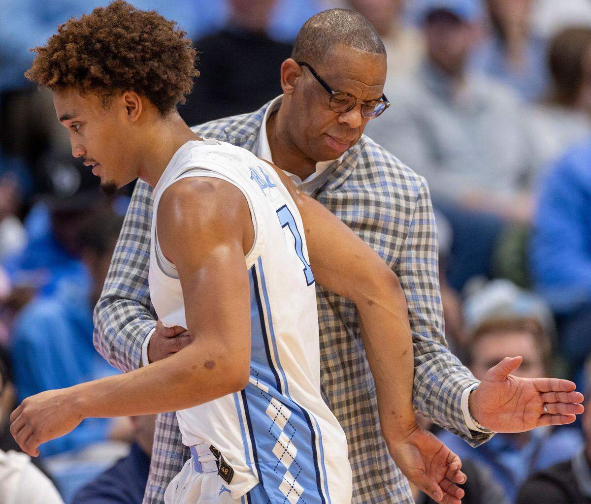 North Carolina coach Hubert Davis gives Seth Trimble (7) a pat in the back as he comes out of the game in the second half against California on Wednesday, January 15, 2025 at the Smith Center in Chapel Hill, N.C. Trimble scored 12 points in the Tar Heels’ victory.