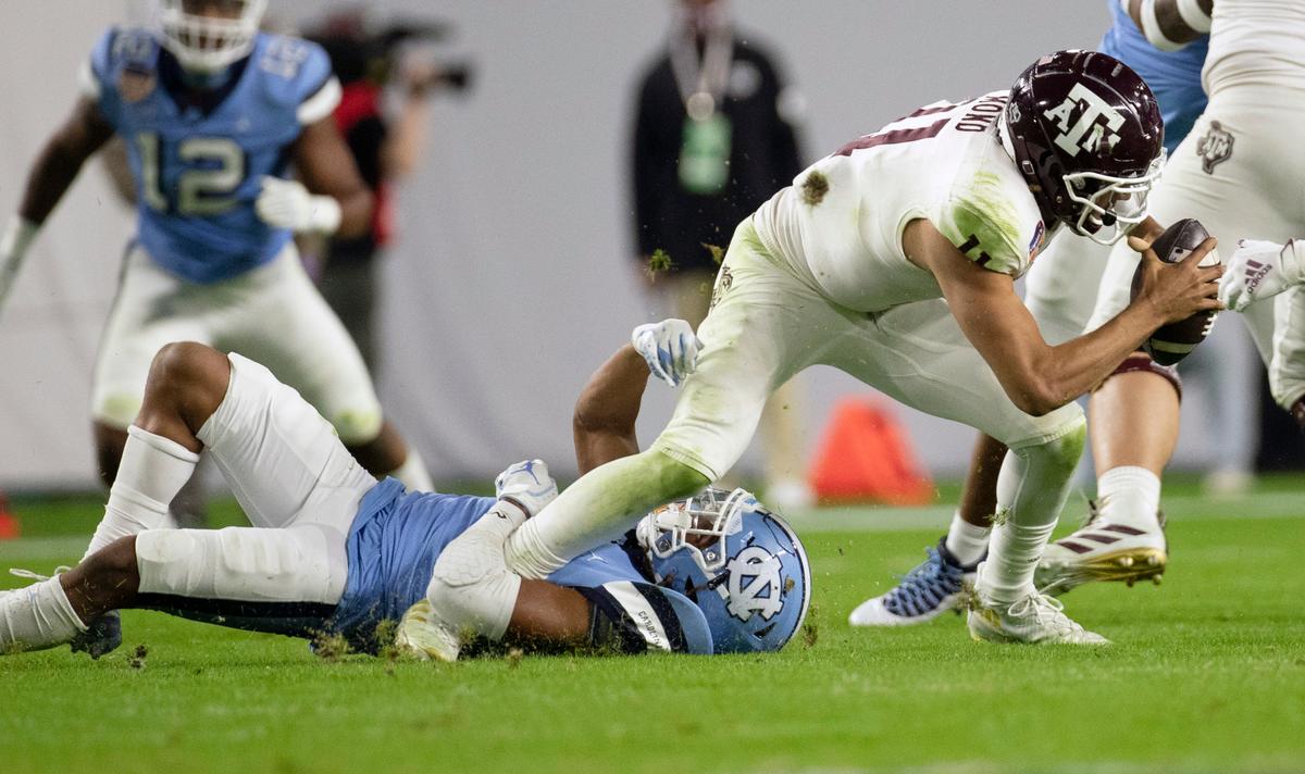 North Carolina’s Trey Morrison (4) sacks Texas A&M quarterback Kellen Mond (11) in the second quarter of the Capital One Orange Bowl on Saturday, January 2, 2021in Miami Gardens, Florida. O’Neal was called for a face mask penalty.