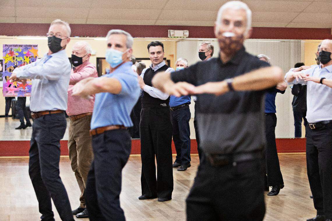 Ruslan Golovashchenko center, the two-time Ukrainian ballroom dance champion teaches a master class at Fred Astaire Dance Studio in Durham on Tuesday, March 1, 2022. Golovashchenko is stranded in Durham while his family escapes Kyiv.