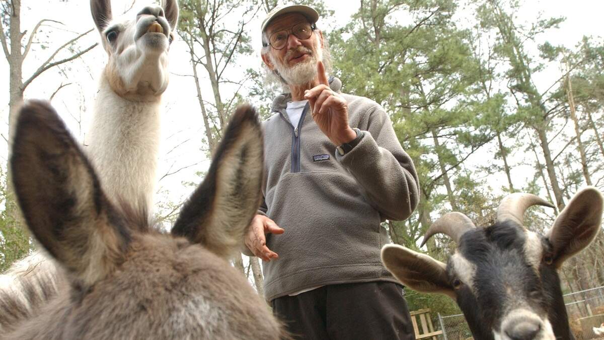 Peter Klopfer, then a professor of biology at Duke University, tells the story of some of his Orange County farm's barnyard residents in a file photo from 2003. Klopfer, who was involved in a sit-in at the Watts Grill in 1964, has died.