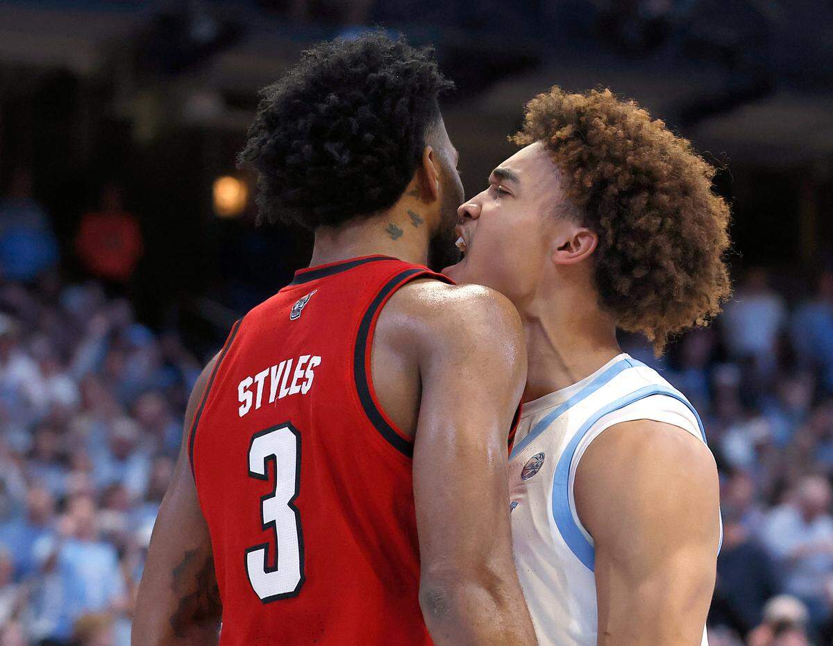 North Carolina’s Seth Trimble reacts after driving to the basket against N.C. State’s Dontrez Styles during the first half of the Tar Heels’ game on Wednesday, Feb. 19, 2025, at the Smith Center in Chapel Hill, N.C.