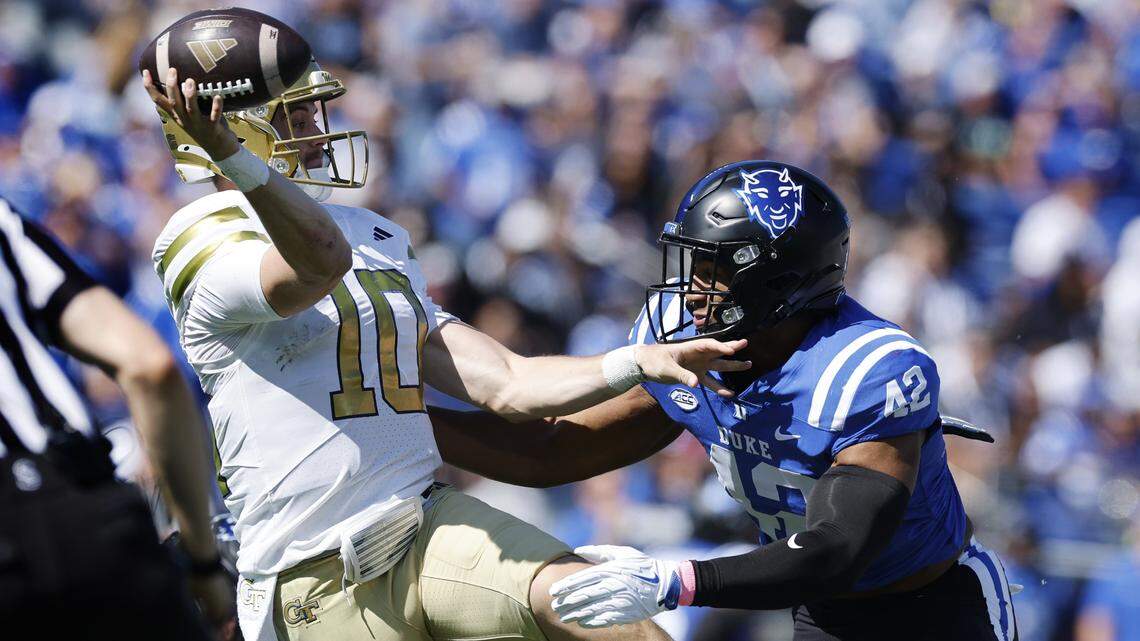 Duke linebacker Kendall Johnson (42) pressures Georgia Tech quarterback Haynes King (10) causing him to make a bad throw during the first half of Duke’s game against Georgia Tech at Wallace Wade Stadium in Durham, N.C., Saturday, Oct. 18, 2025.