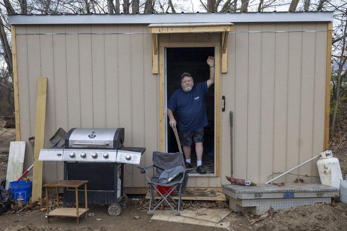 Thomas Whiteside stands in the door of temporary housing on his Black Mountain property in late November 2024. Cabins 4 Christ built many of such structures to help shelter some of the many people across Western North Carolina who lost their homes due to Helene’s historic destruction. 