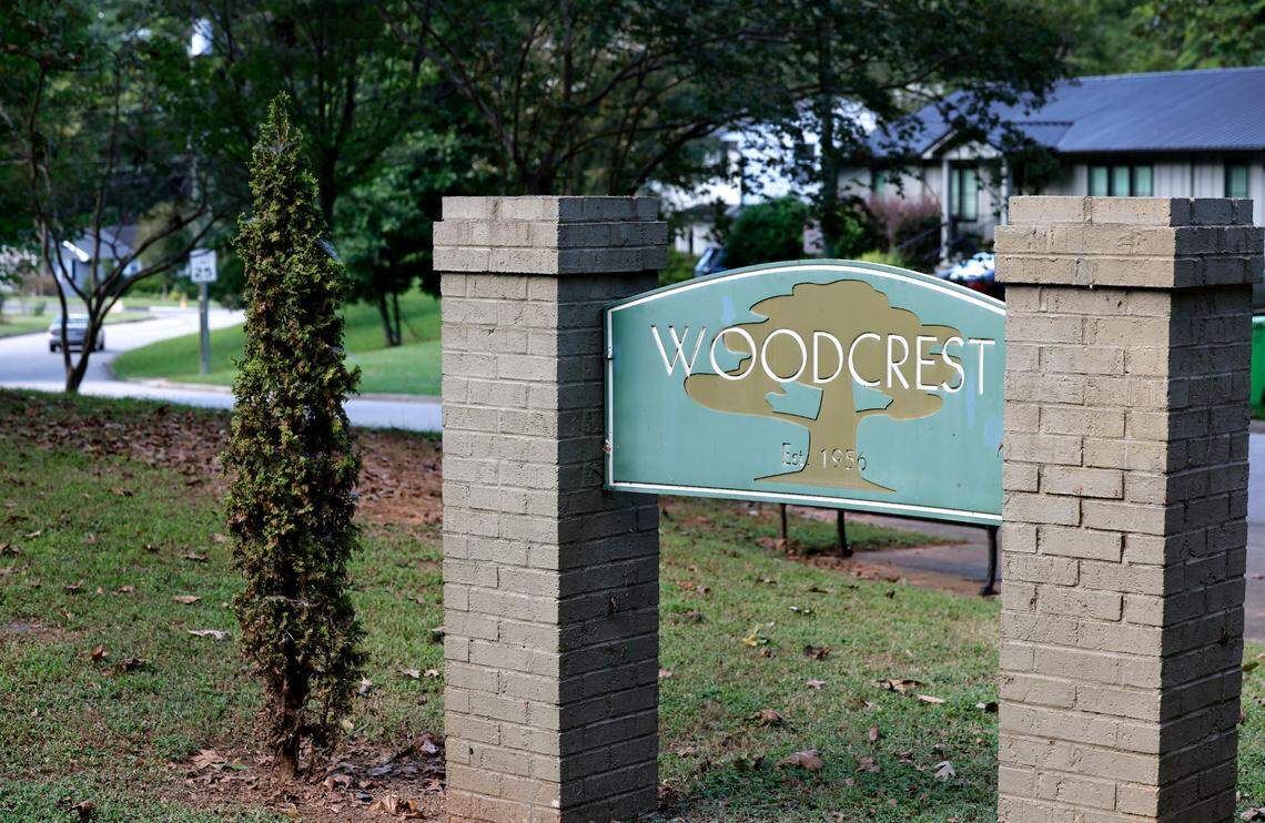 A sign for the Woodcrest neighborhood at Dennis Ave and Timber Drive in Raleigh, photographed Thursday, Sept. 5, 2024.