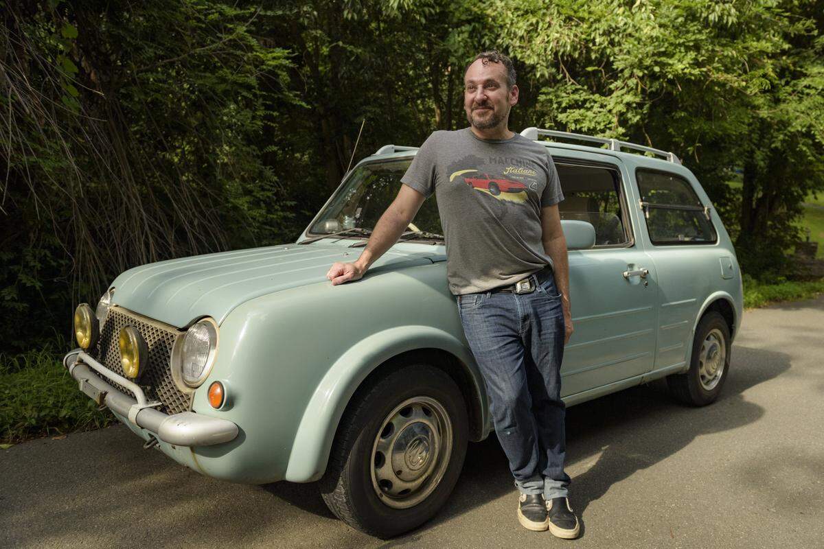 Car expert Jason Torchinsky poses for a portrait with his Nissan Pao in Chapel Hill, NC. Torchinsky is a senior editor at Jalopnik.com where he writes about unique cars and the future of driving.