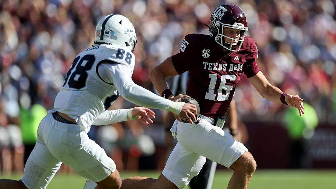 COLLEGE STATION, TEXAS - NOVEMBER 22: Miles O'Neill #16 of the Texas A&M Aggies scrambles against Donovan Grayson #88 of the Samford Bulldogs in the second half at Kyle Field on November 22, 2025 in College Station, Texas. (Photo by Tim Warner/Getty Images)