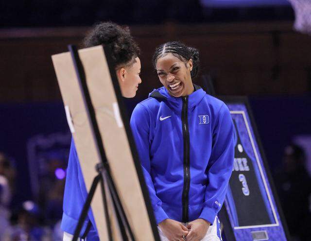 Duke’s Taina Mair and Ashlon Jackson smile during a senior day ceremony prior to the Blue Devils’ game against North Carolina on Sunday, Feb. 15, 2026, at Cameron Indoor Stadium in Durham, N.C.