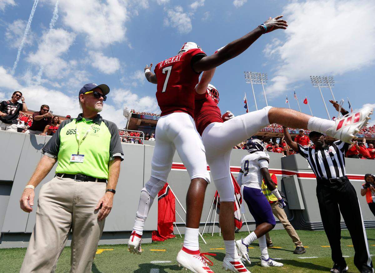N.C. State quarterback Matt McKay (7) celebrates with tight end Cary Angeline (6) after Angeline scored on a touchdown reception during the first half of N.C. State’s game against Western Carolina at Carter-Finley Stadium in Raleigh, N.C., Saturday, Sept. 7, 2019.