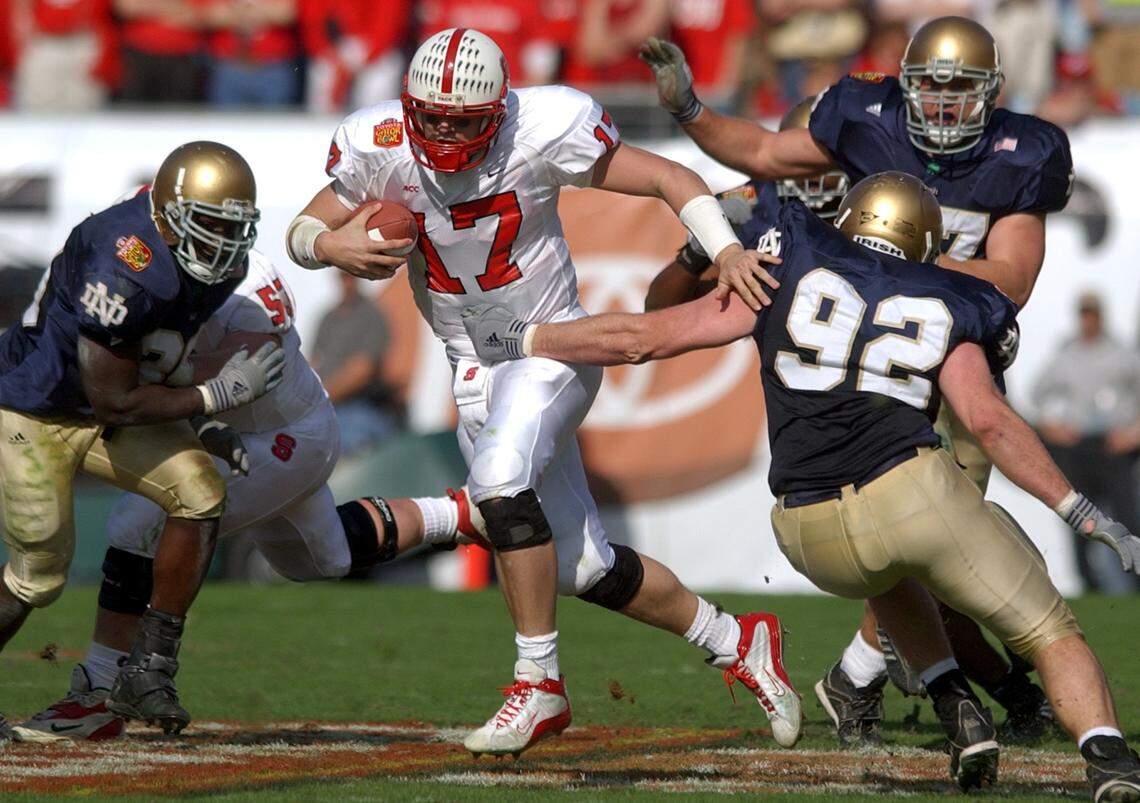 N.C. State’s Philip Rivers breaks a hole in the Notre Dame defense during the Gator Bowl at Alltel Stadium in Jacksonville, Florida in January 2003. The Wolfpack beat the Irish 28-6.