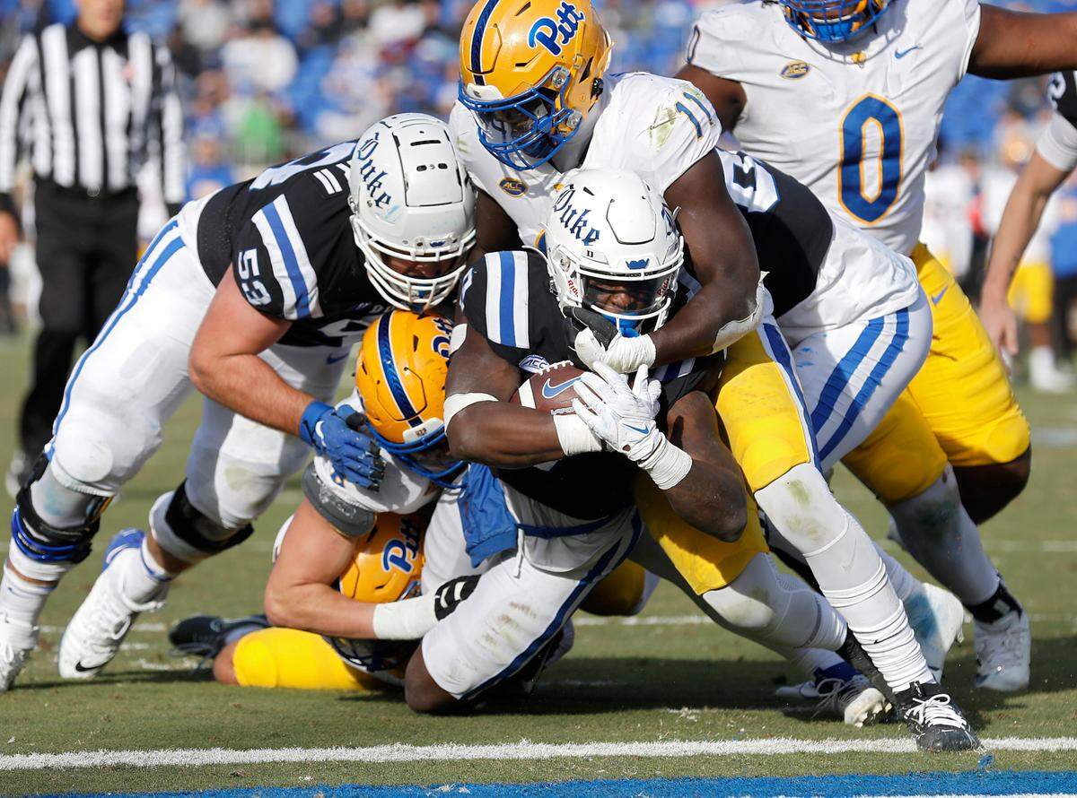 Duke’s Jaquez Moore powers through the Pittsburgh defense to score a touchdown during the second half of the Blue Devils’ 30-19 win over Pittsburgh on Saturday, Nov. 25, 2023, at Wallace Wade Stadium in Durham, N.C.