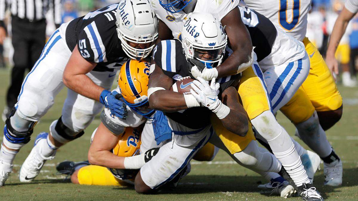Duke’s Jaquez Moore powers through the Pittsburgh defense to score a touchdown during the second half of the Blue Devils’ 30-19 win over Pittsburgh on Saturday, Nov. 25, 2023, at Wallace Wade Stadium in Durham, N.C.