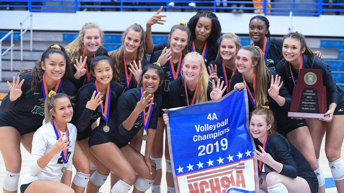 Green Hope pose with the trophy. The Green Hope Falcons played the Ardrey Kell Knights in a high school volleyball game that counted for the NCHSAA 4A Championship on November 9, 2019.