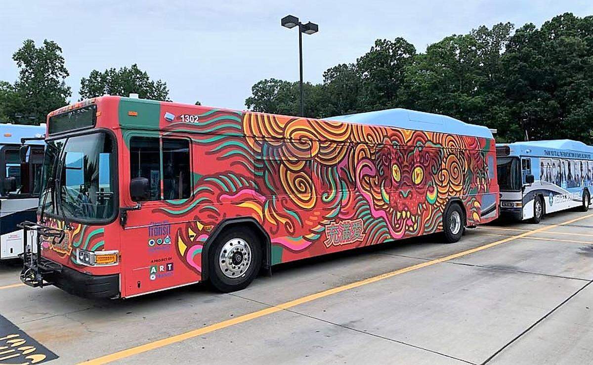 The dog is a symbol of friendship, loyalty and honesty in Chinese culture. This one appears to leap from the side of a Chapel Hill Transit bus in North Carolina