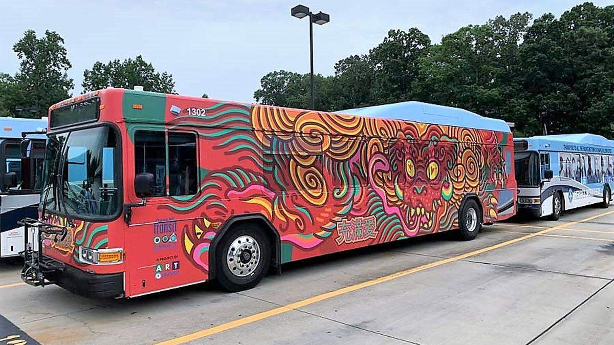 The dog is a symbol of friendship, loyalty and honesty in Chinese culture. This one appears to leap from the side of a Chapel Hill Transit bus in North Carolina