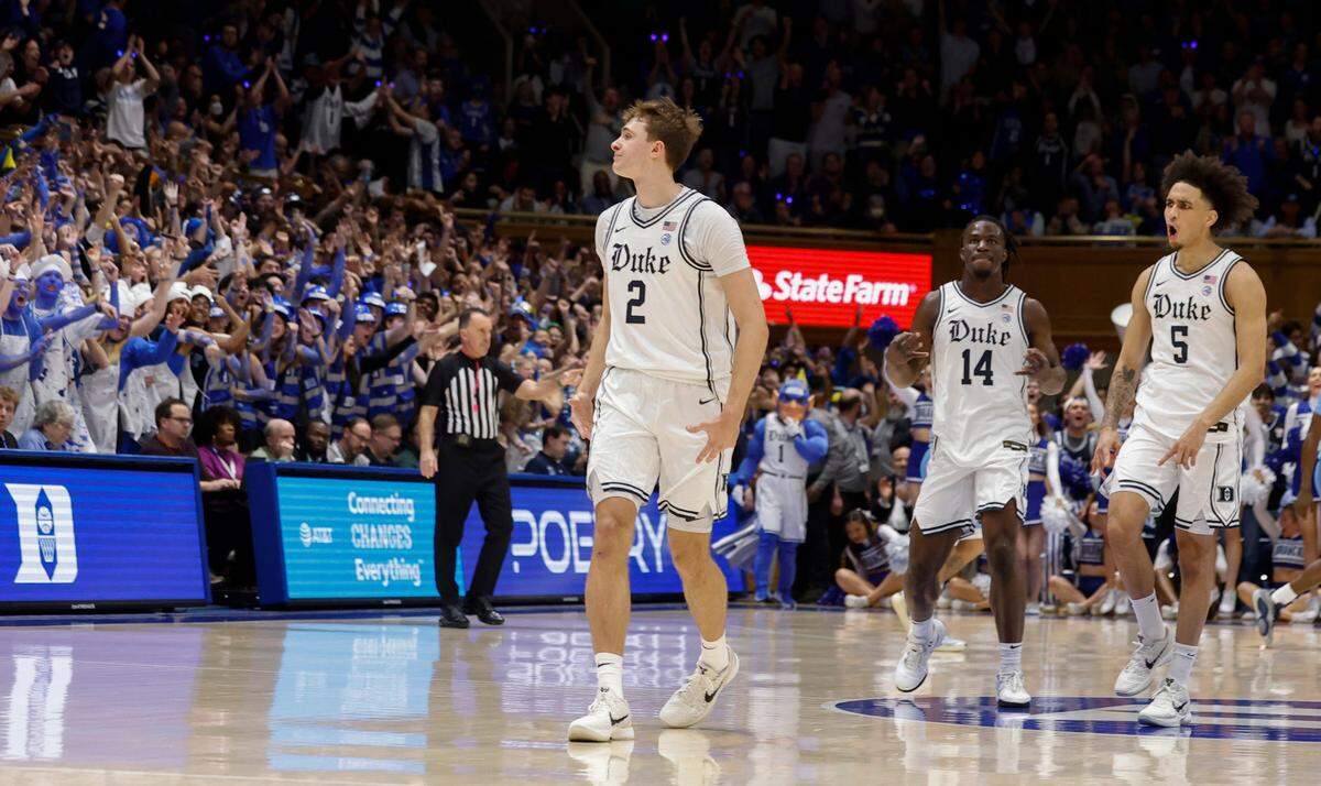 Duke’s Sion James (14) and Tyrese Proctor (5) celebrate with Cooper Flagg (2) during the first half of Duke’s game against UNC at Cameron Indoor Stadium in Durham, N.C., Saturday, Feb. 1, 2025.