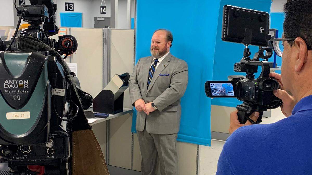 North Carolina DMV Commissioner Wayne Goodwin on the day he got his REAL ID driver license in Raleigh in September 2022.