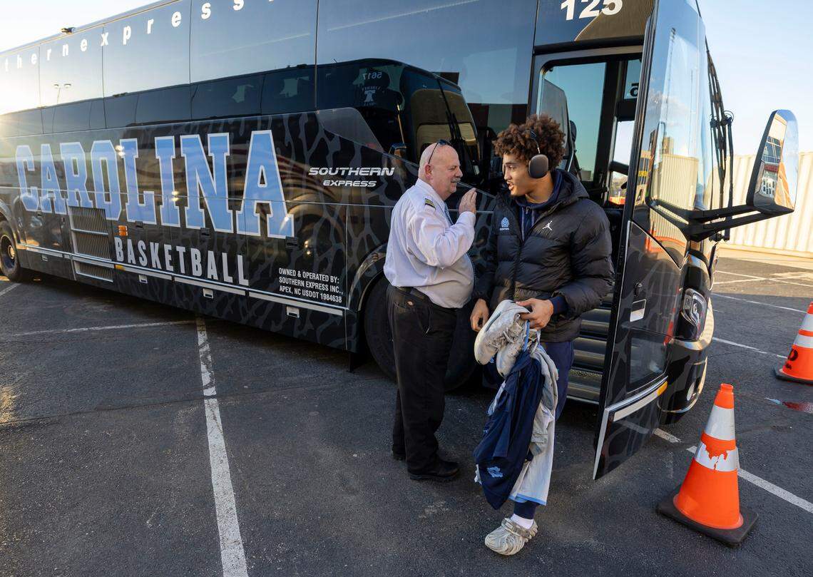 North Carolina guard Seth Trimble (7) steps off the team bus as the Tar Heels arrive at the University of Dayton Arena for practice ahead of their First Four game in the NCAA Tournament on Monday, March 17, 2025 in Dayton, Ohio. The team was delayed after issues with their charter flight.