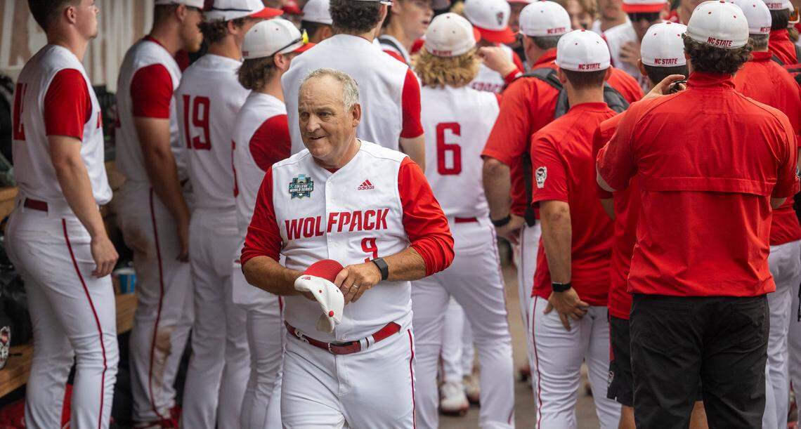 N.C. State coach Elliott Avent steps away from a huddle with his team following their 5-4 loss to Florida in game seven of the College World Series on Monday, June 17, 2024 at Charles Schwab Field in Omaha, Nebraska.