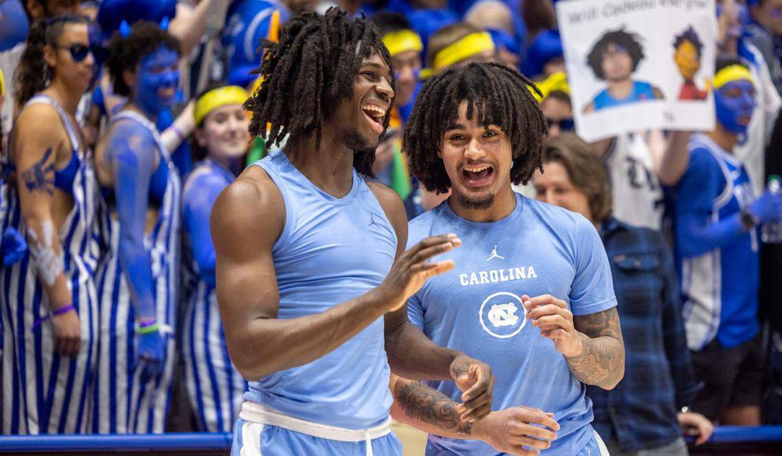 North Carolina guards Ian Jackson (11) and Elliot Cadeau (3) crack smiles as they are harassed by the ‘Cameron Crazies’ behind them, as they warm up for the Tar Heels’ game against Duke on Saturday, February 1, 2025 at Cameron Indoor Stadium in Durham, N.C.