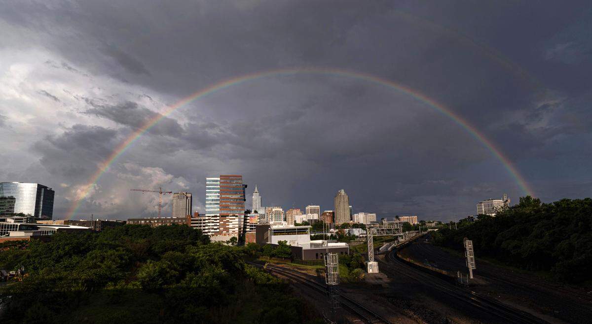 A rainbow stretches across downtown Raleigh after rainstorms on May 12, 2025.