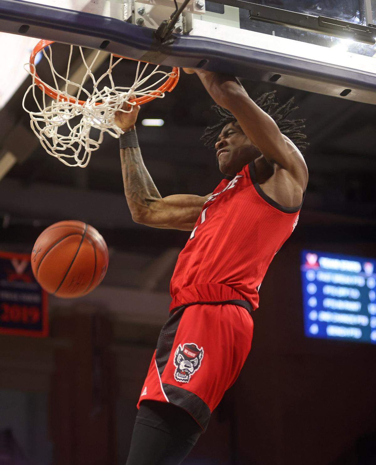 North Carolina State guard Dereon Seabron (1) dunks the ball during the game against Virginia Wednesday in Charlottesville.